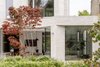 Reconfigured house in Wimbledon with rear extension, landscaped garden and large areas of glazing